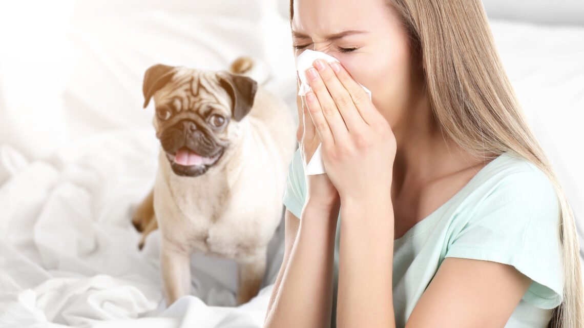 Woman sneezing from allergies